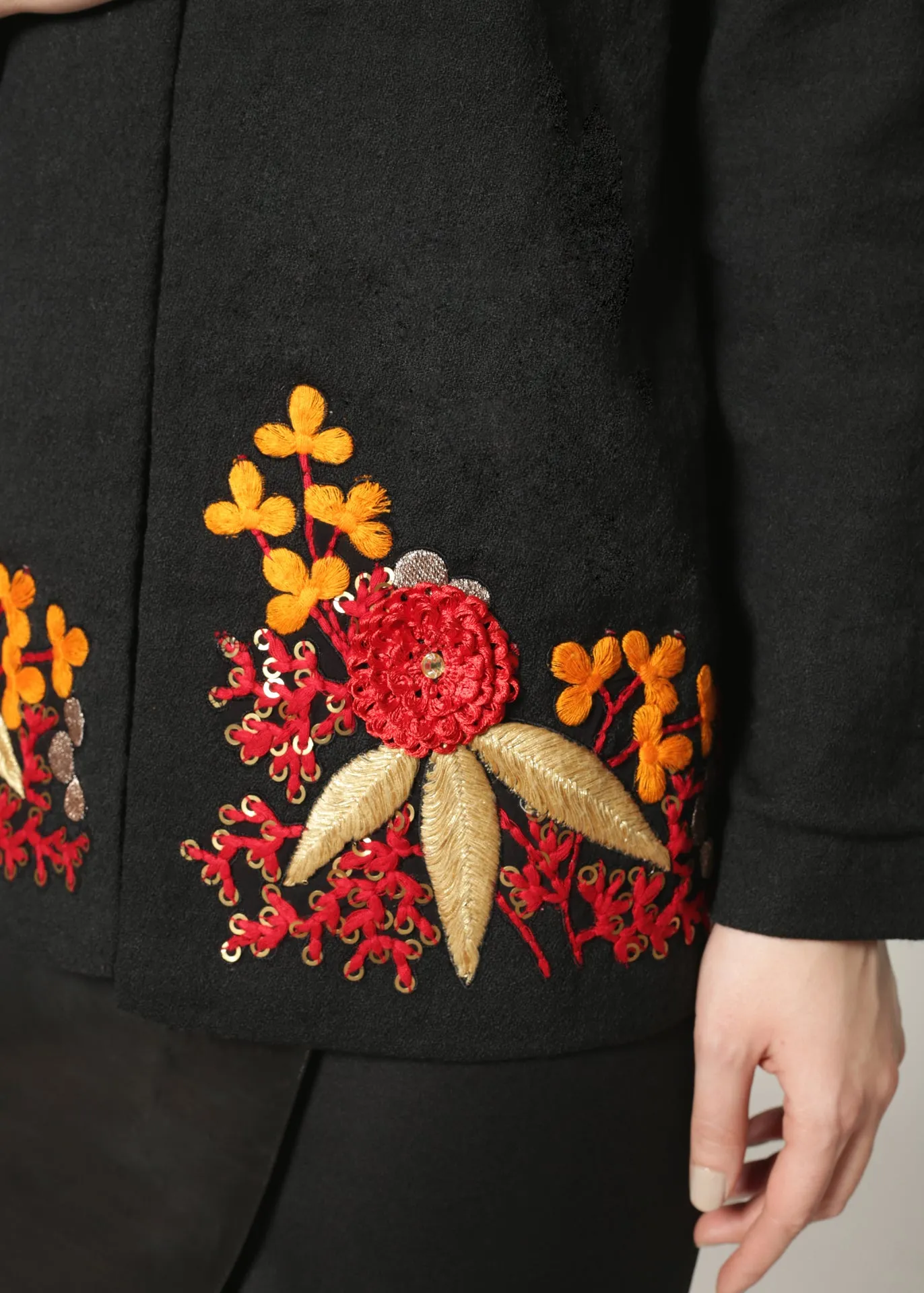 Wool jacket with cutout shoulders and embroidery details